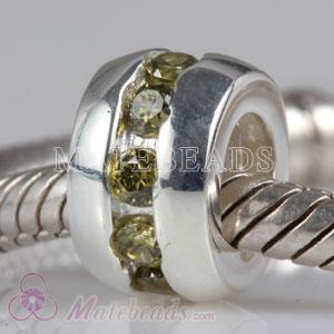 Sterling silver bead with green stones